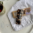  Шоколад молочный с сосновой шишкой, черникой и кедровый орех